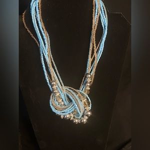 Blue beaded knotted necklace.